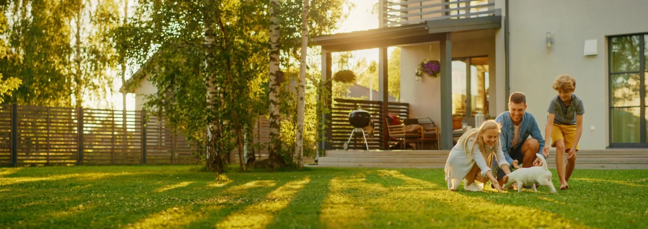 family in yard with dog