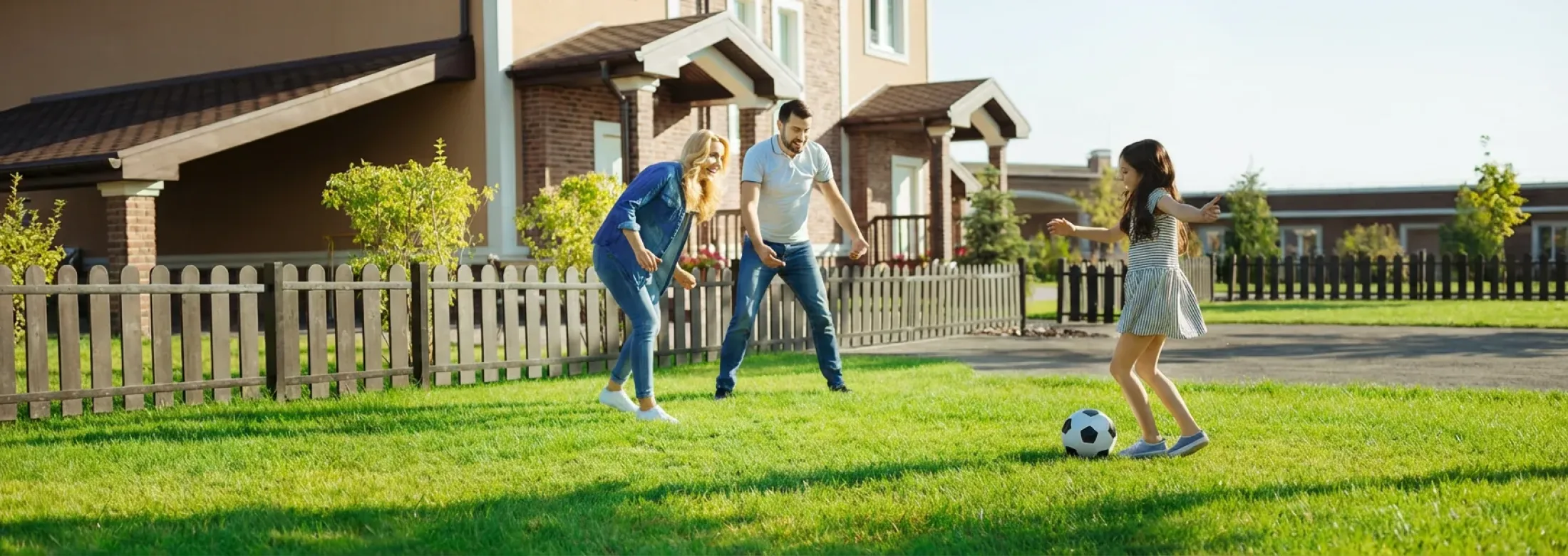 family playing soccer