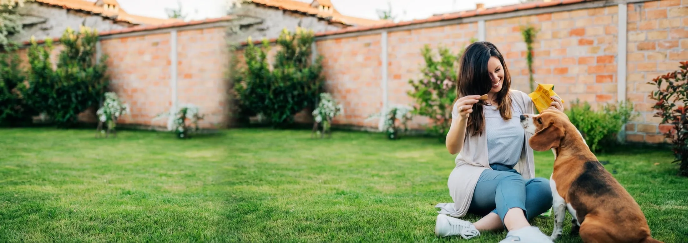 woman and dog in yard